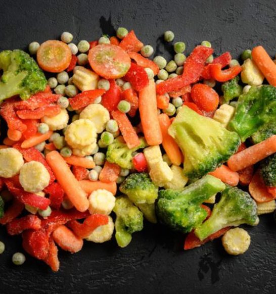 Frozen-vegetables-against-black-blancher-cooler-scaled-e1700600545160